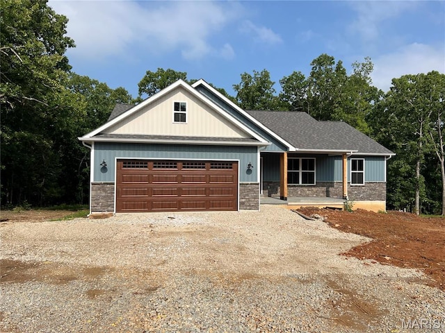 518 Rue Lamande, Bonne Terre, MO 63628 - craftsman inspired home featuring stone siding, driveway, a garage, and covered porch