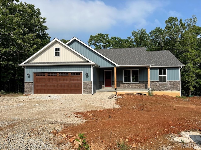 518 Rue Lamande, Bonne Terre, MO 63628 - craftsman inspired home featuring a porch, stone siding, driveway, and an attached garage