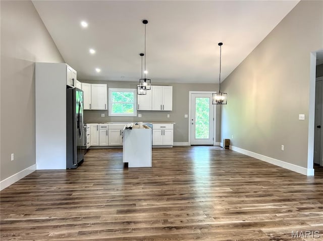 518 Rue Lamande, Bonne Terre, MO 63628 - kitchen with freestanding refrigerator, dark wood-type flooring, plenty of natural light, a center island, and high vaulted ceiling