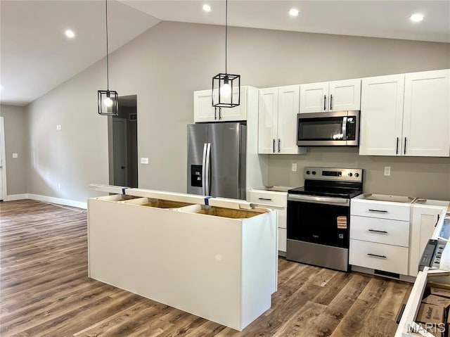 518 Rue Lamande, Bonne Terre, MO 63628 - kitchen featuring appliances with stainless steel finishes, white cabinetry, a kitchen island, dark wood-type flooring, and pendant lighting