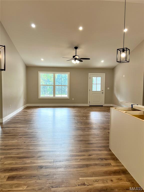 518 Rue Lamande, Bonne Terre, MO 63628 - unfurnished living room featuring dark wood-type flooring, baseboards, recessed lighting, ceiling fan, and lofted ceiling