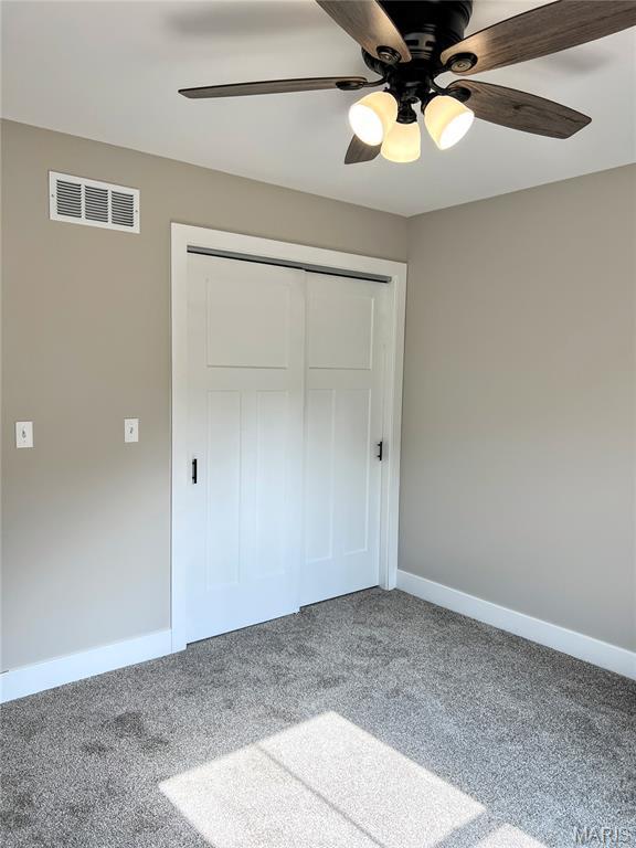 518 Rue Lamande, Bonne Terre, MO 63628 - unfurnished bedroom with carpet flooring, a closet, baseboards, and a ceiling fan