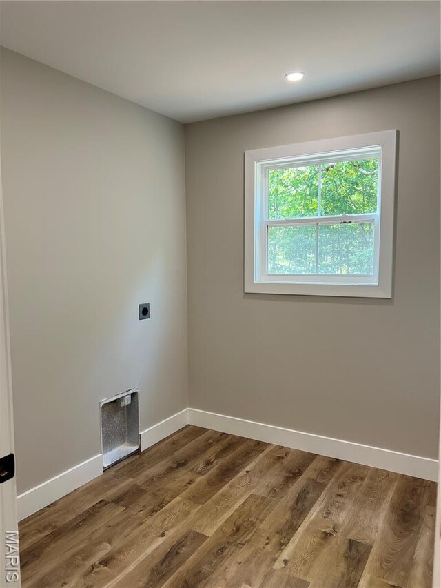 518 Rue Lamande, Bonne Terre, MO 63628 - laundry area featuring electric dryer hookup, baseboards, wood finished floors, and recessed lighting