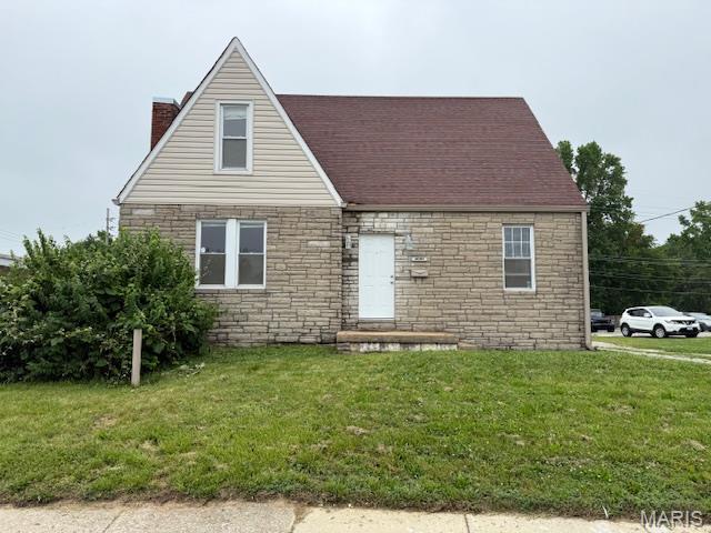 10303 Lincoln Trl, Fairview Heights, IL 62208 - view of front facade featuring a chimney, stone siding, and a front yard