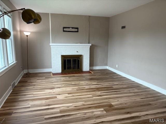 10303 Lincoln Trl, Fairview Heights, IL 62208 - unfurnished living room with wood finished floors and a fireplace