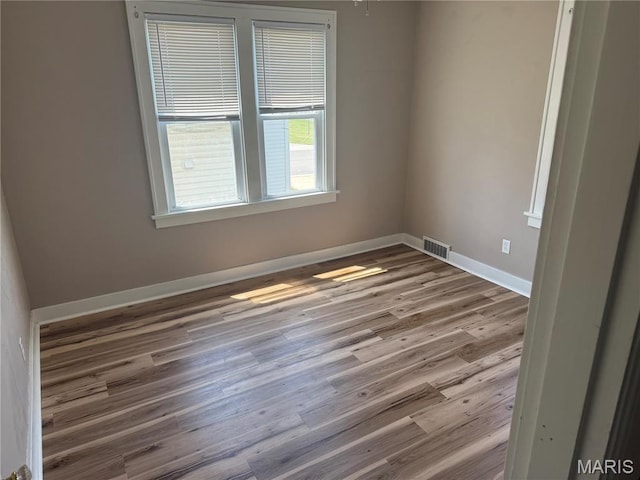 10303 Lincoln Trl, Fairview Heights, IL 62208 - spare room featuring wood finished floors and baseboards