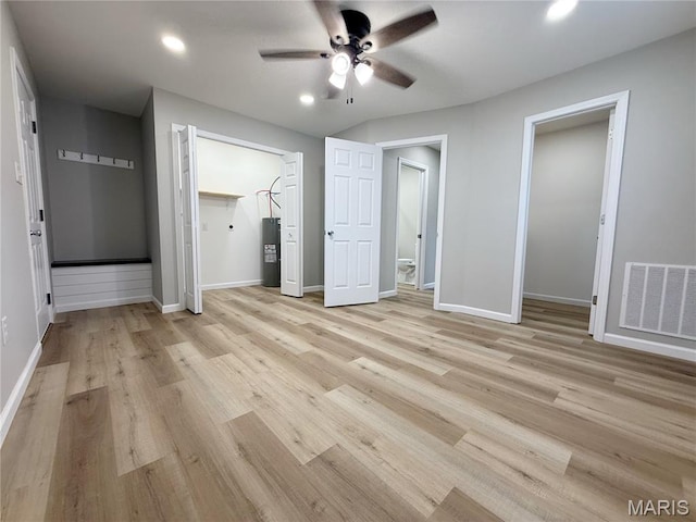 604 N Henderson St Unit A & B, Salem, MO 65560 - unfurnished bedroom featuring water heater, light wood-style floors, baseboards, recessed lighting, and a ceiling fan