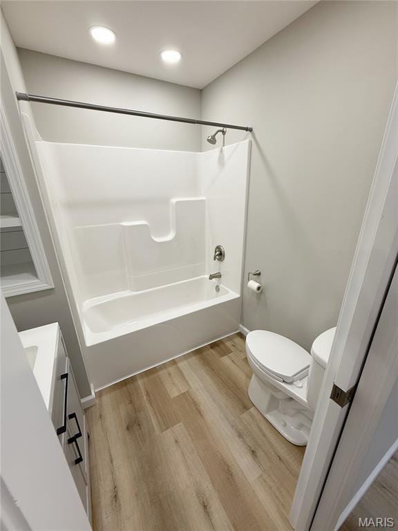 604 N Henderson St Unit A & B, Salem, MO 65560 - bathroom with toilet, shower / bathtub combination, wood finished floors, and vanity