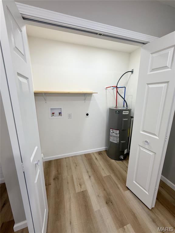 604 N Henderson St Unit A & B, Salem, MO 65560 - laundry room featuring water heater, hookup for a washing machine, light wood-style flooring, electric dryer hookup, and baseboards