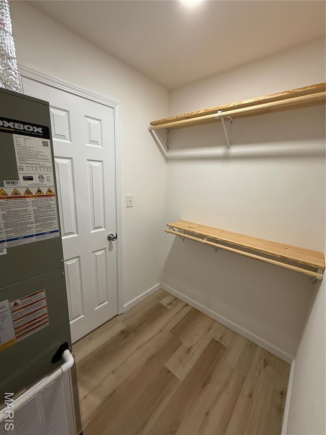 604 N Henderson St Unit A & B, Salem, MO 65560 - walk in closet with light wood finished floors and heating unit