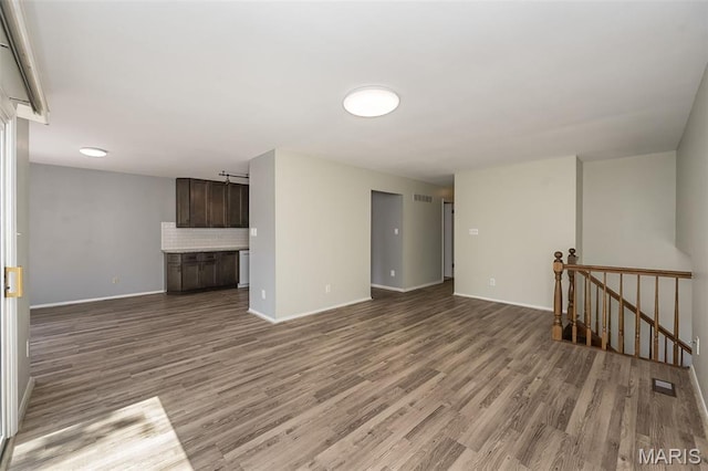 2237 Ole Castle Ct, Chesterfield, MO 63017 - unfurnished living room with wood finished floors and baseboards