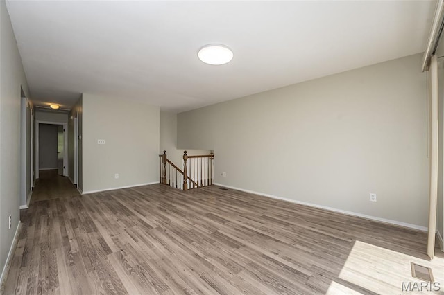 2237 Ole Castle Ct, Chesterfield, MO 63017 - empty room featuring wood finished floors and baseboards