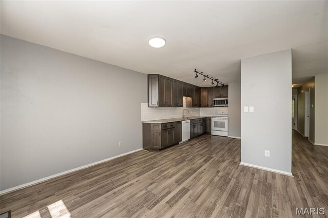 2237 Ole Castle Ct, Chesterfield, MO 63017 - kitchen featuring stove, stainless steel microwave, dishwashing machine, light countertops, and wood finished floors