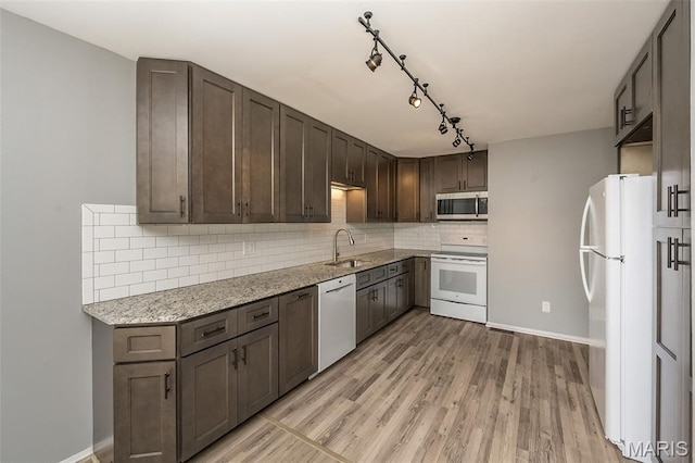 2237 Ole Castle Ct, Chesterfield, MO 63017 - kitchen featuring white appliances, decorative backsplash, light wood-style flooring, dark brown cabinetry, and light stone countertops