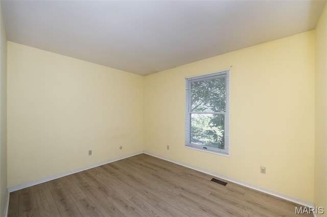 2237 Ole Castle Ct, Chesterfield, MO 63017 - spare room featuring light wood-type flooring and baseboards