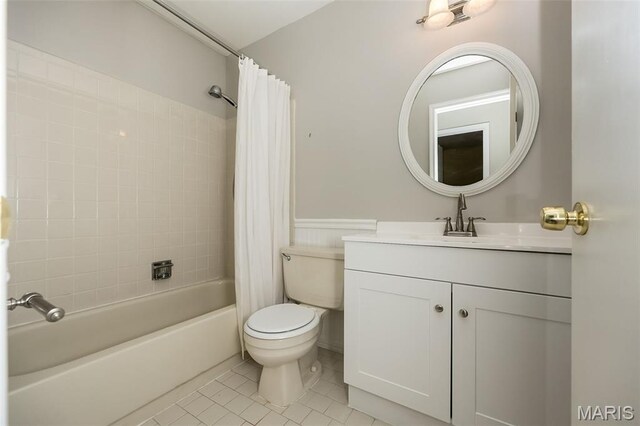2237 Ole Castle Ct, Chesterfield, MO 63017 - full bath with vanity, shower / bath combination with curtain, tile patterned floors, and a wainscoted wall