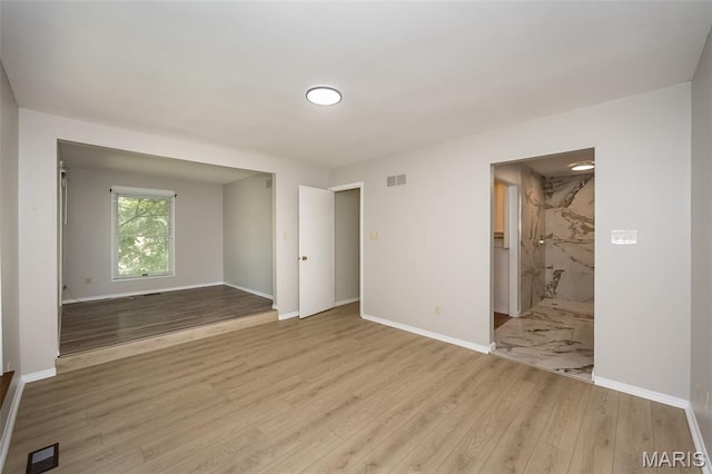 2237 Ole Castle Ct, Chesterfield, MO 63017 - spare room featuring wood finished floors and baseboards