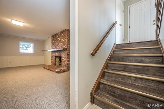 2237 Ole Castle Ct, Chesterfield, MO 63017 - stairs featuring wainscoting, a fireplace, and carpet flooring