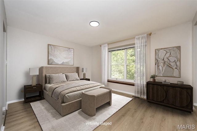 2237 Ole Castle Ct, Chesterfield, MO 63017 - bedroom featuring wood finished floors and baseboards