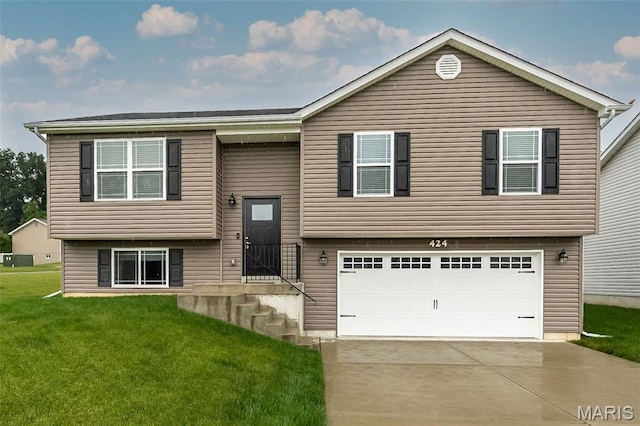 424 Triathlon Dr, Foristell, MO 63348 - raised ranch with an attached garage, a front yard, and driveway