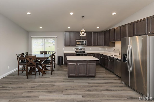 424 Triathlon Dr, Foristell, MO 63348 - kitchen featuring stainless steel appliances, a sink, light countertops, recessed lighting, and dark brown cabinets