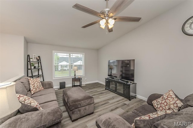 424 Triathlon Dr, Foristell, MO 63348 - living room with wood finished floors, a ceiling fan, baseboards, and lofted ceiling