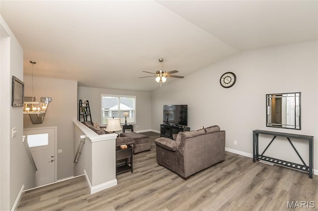 424 Triathlon Dr, Foristell, MO 63348 - living area featuring light wood-type flooring, baseboards, lofted ceiling, a chandelier, and ceiling fan