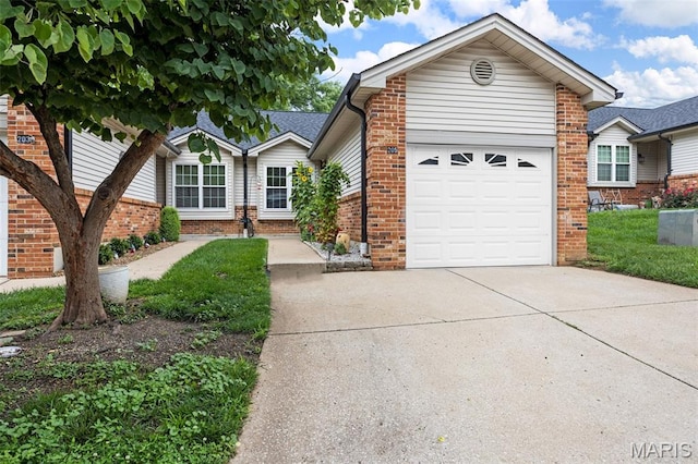 205 Fawn Meadow Ct, Ofallon, MO 63366 - view of front of house featuring brick siding, concrete driveway, and an attached garage