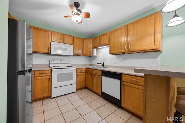 205 Fawn Meadow Ct, Ofallon, MO 63366 - kitchen featuring white appliances, tasteful backsplash, light tile patterned flooring, and light countertops