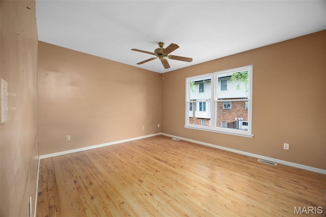205 Fawn Meadow Ct, Ofallon, MO 63366 - spare room featuring a ceiling fan and light wood finished floors