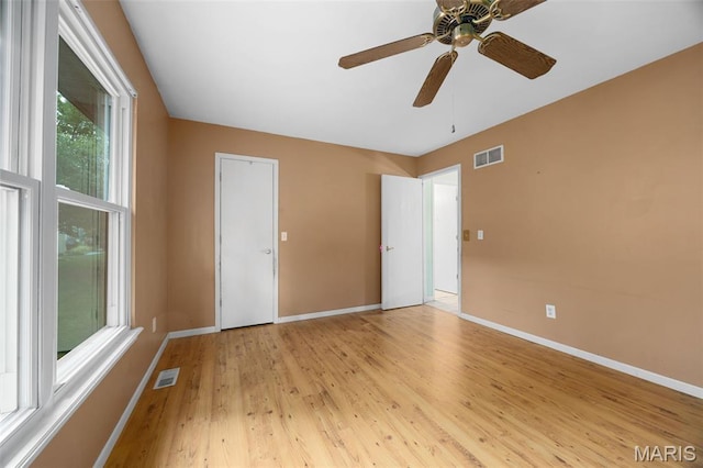 205 Fawn Meadow Ct, Ofallon, MO 63366 - unfurnished bedroom with light wood-style floors and a ceiling fan