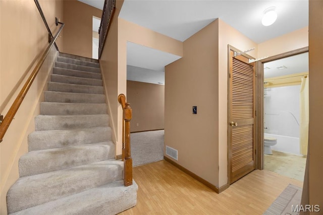 205 Fawn Meadow Ct, Ofallon, MO 63366 - stairs featuring wood finished floors and baseboards