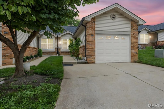 205 Fawn Meadow Ct, Ofallon, MO 63366 - view of front of home featuring brick siding, an attached garage, and driveway