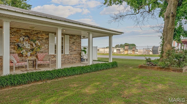17504 Division St, Kennett, MO 63857 - view of green lawn with a porch