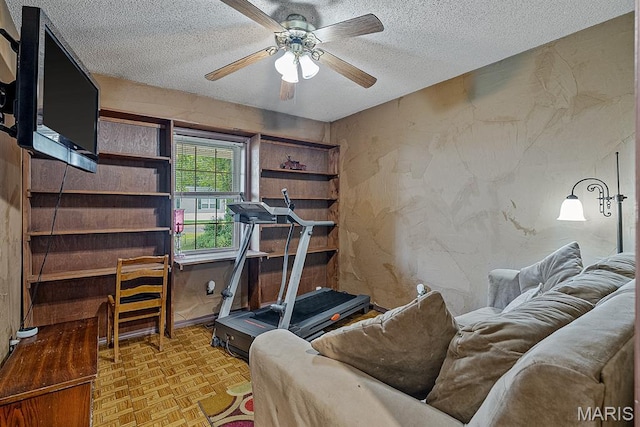 17504 Division St, Kennett, MO 63857 - exercise area featuring a textured ceiling and a ceiling fan