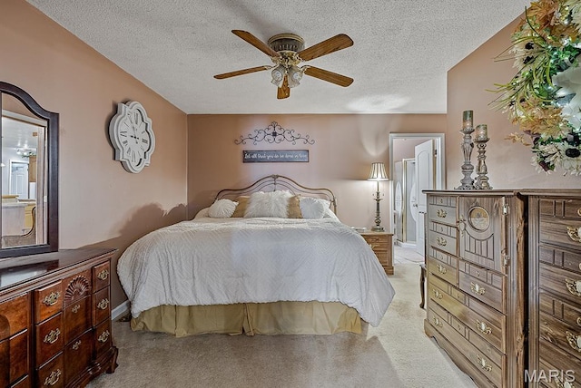 17504 Division St, Kennett, MO 63857 - bedroom featuring a textured ceiling, ensuite bathroom, a ceiling fan, and baseboards
