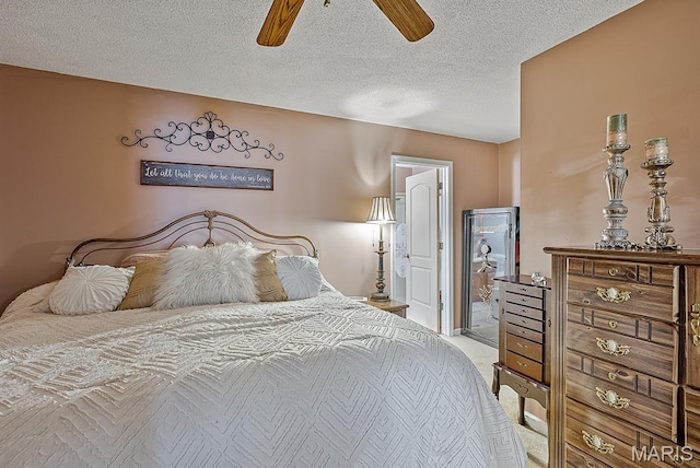 17504 Division St, Kennett, MO 63857 - bedroom with carpet floors, a textured ceiling, and ceiling fan