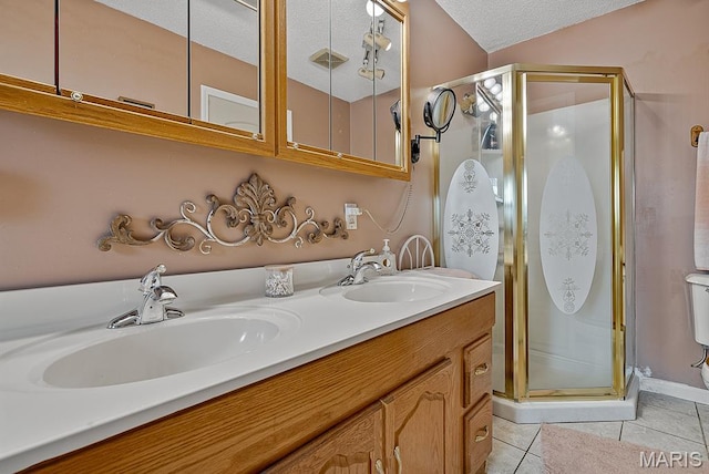 17504 Division St, Kennett, MO 63857 - bathroom with double vanity, a shower stall, tile patterned floors, and a textured ceiling