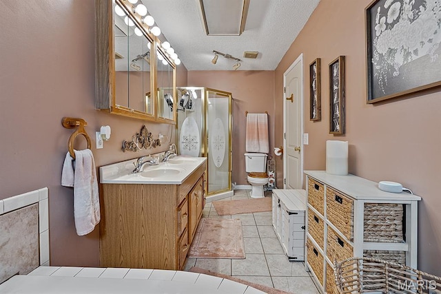 17504 Division St, Kennett, MO 63857 - full bathroom with vanity, toilet, a stall shower, a textured ceiling, and tile patterned flooring