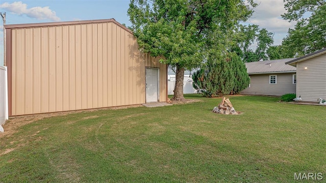 17504 Division St, Kennett, MO 63857 - view of grassy yard featuring a fire pit