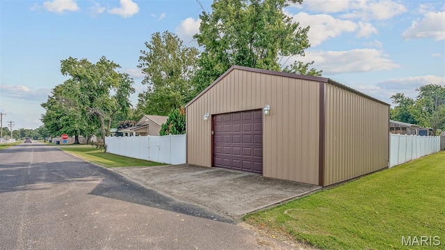 17504 Division St, Kennett, MO 63857 - detached garage featuring asphalt driveway