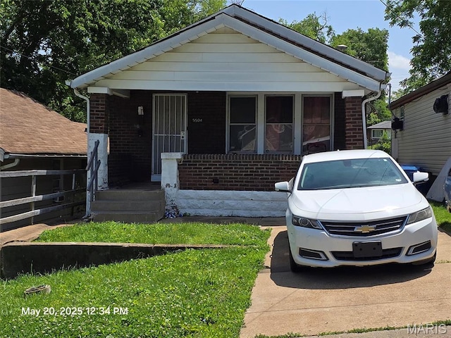 5504 Janet Ave, Jennings, MO 63136 - view of front of home with brick siding and a porch