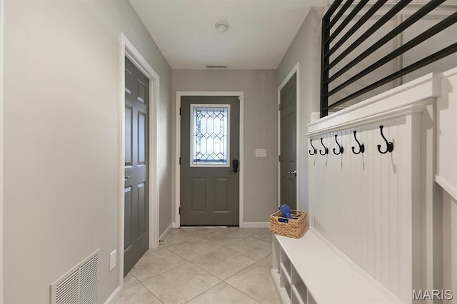 6620 Lake Point Dr Unit 26, Osage Beach, MO 65065 - mudroom with light tile patterned floors and baseboards