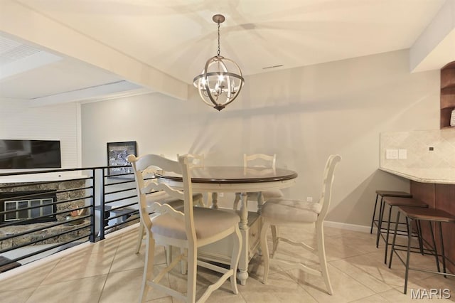 6620 Lake Point Dr Unit 26, Osage Beach, MO 65065 - tiled dining area with a chandelier and baseboards