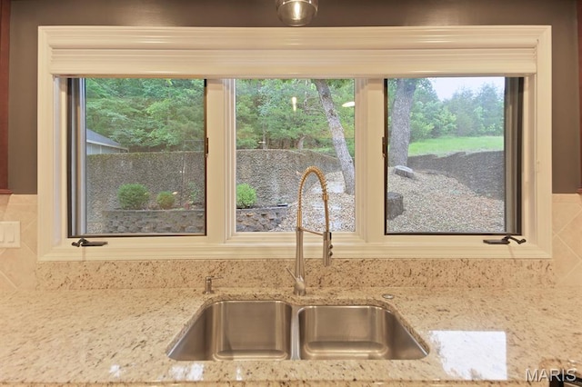 6620 Lake Point Dr Unit 26, Osage Beach, MO 65065 - kitchen view of a sink and light stone counters
