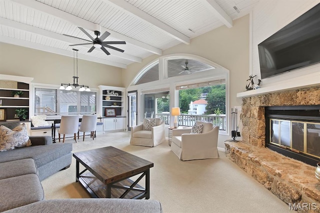 6620 Lake Point Dr Unit 26, Osage Beach, MO 65065 - living room with ceiling fan, carpet, a glass covered fireplace, beamed ceiling, and high vaulted ceiling