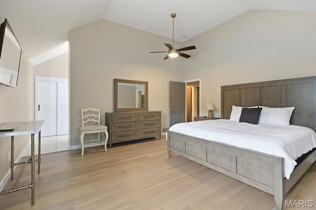 6620 Lake Point Dr Unit 26, Osage Beach, MO 65065 - bedroom with vaulted ceiling, light wood-style flooring, a ceiling fan, and baseboards