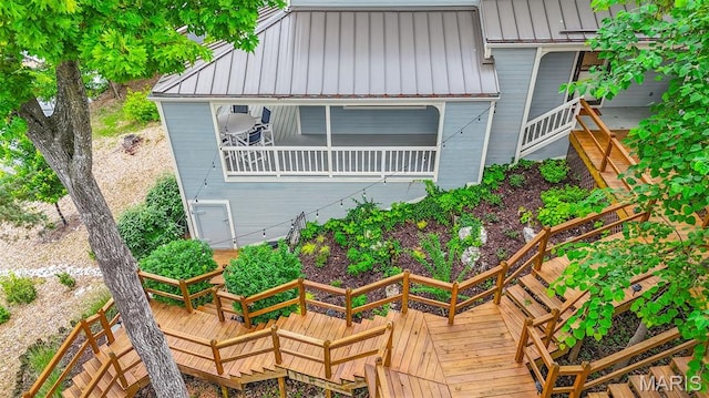 6620 Lake Point Dr Unit 26, Osage Beach, MO 65065 - back of house with board and batten siding, stairway, and a deck
