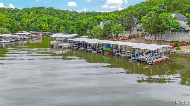 6620 Lake Point Dr Unit 26, Osage Beach, MO 65065 - dock area featuring boat lift, a water view, and a forest view
