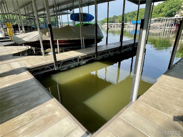 6620 Lake Point Dr Unit 26, Osage Beach, MO 65065 - dock featuring a water view and boat lift